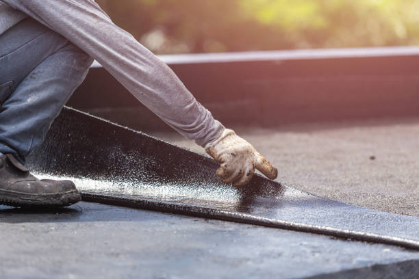 Professional Waterproofing technician working in Milroy, IN